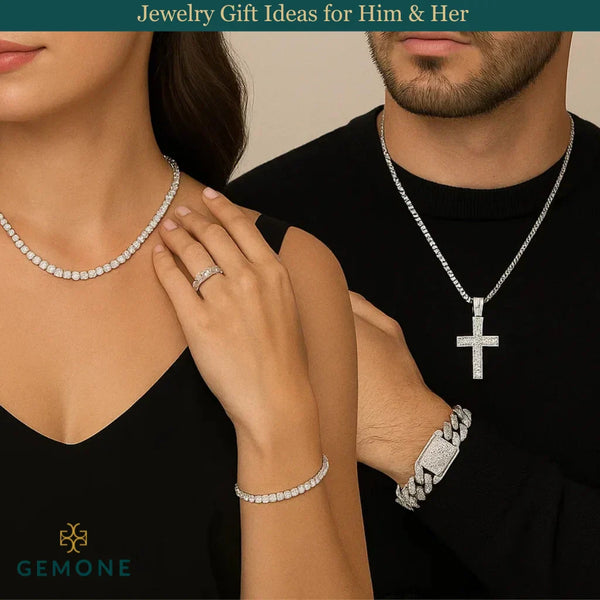 A couple wearing diamond jewelry. The woman showcases a diamond necklace, bracelet, and ring, while the man wears a diamond cross pendant necklace and bracelet.