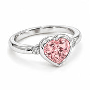 Angled View Of 1.72 Carat Fancy Pink Heart Cut 3 Stone Diamond Ring