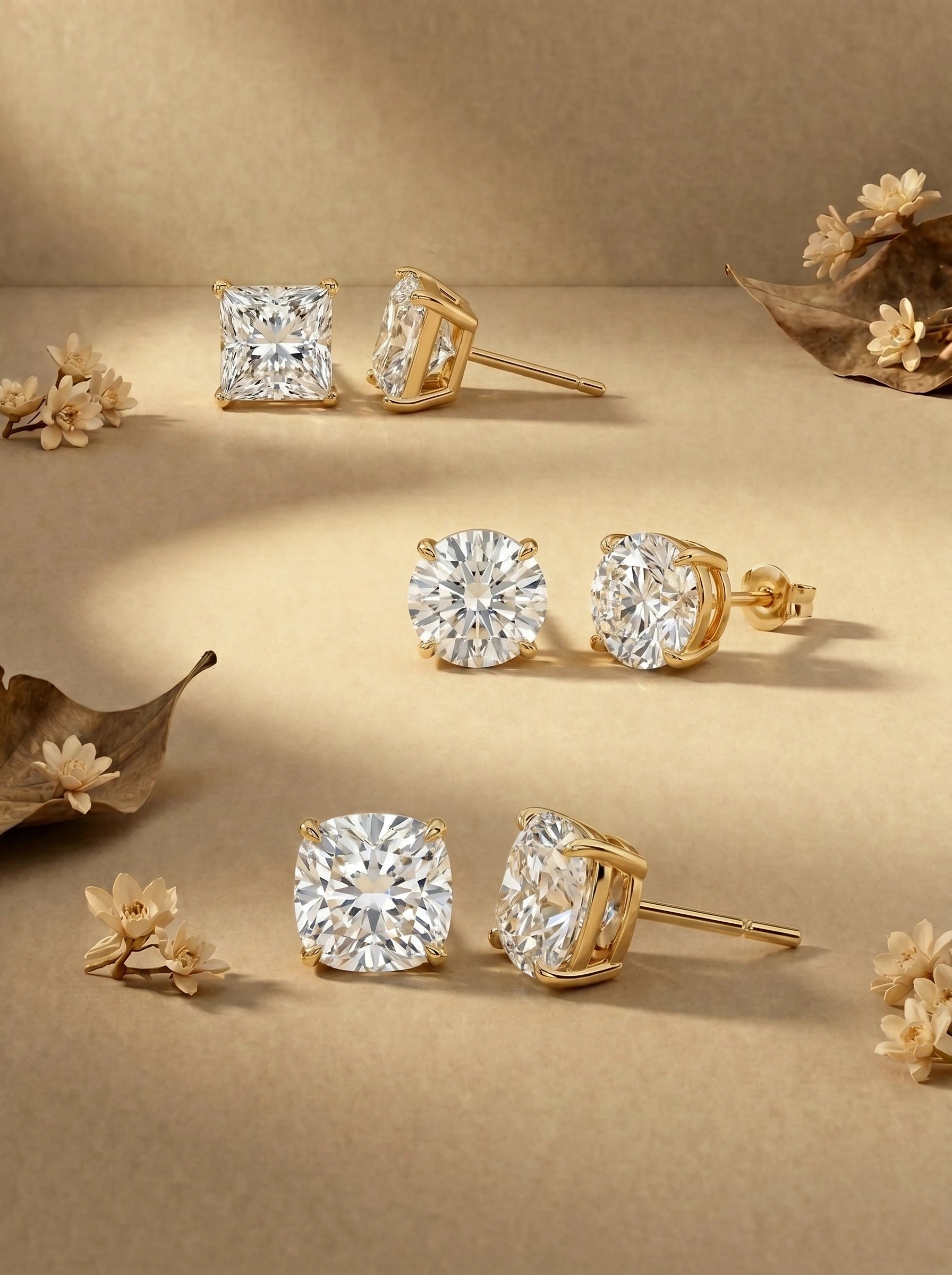 Lab grown diamond gold stud earrings in princess, round and cushion cut set in yellow gold.